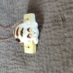 San Francisco Takahashi Cat hanging from wood